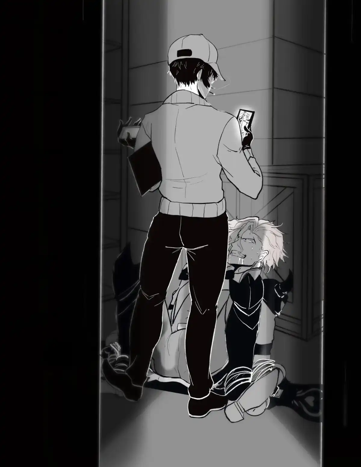 Adam tied up in a storage room as Snake stands over him, recording